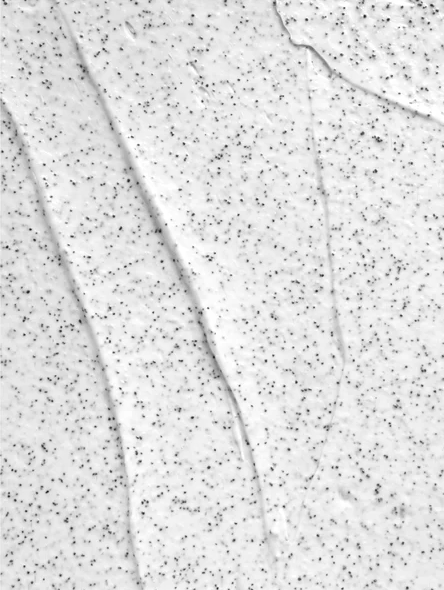 Texture crémeuse d'exfoliant AHA pour le visage avec grains de sable volcanique naturel